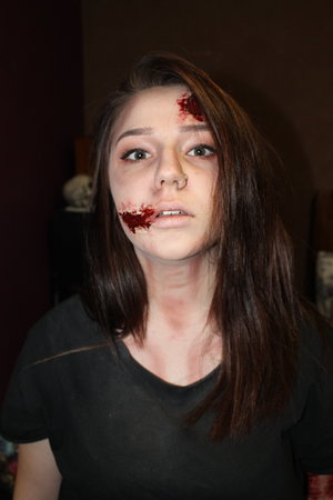 Bit of a late upload, this was from Halloween last year.
I did this on my friend using bronzer to hollow out the face and a lighter foundation than her skin tone to make her look sick. To create the wounds I used a nose and scar wax and a fake blood, making sure to use an edible blood around the mouth area.
Simple and affordable.