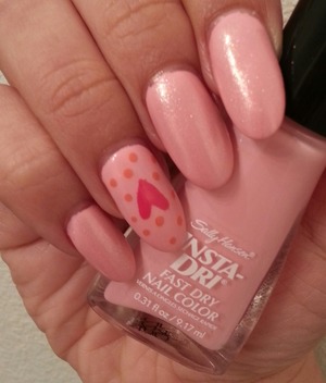 Base color done in Pink Blink by Sally Hansen Insta-Dry. Hearts and Polka dots done in O.P.I Strawberry Margarita and Sinful color in Island Coral. 
