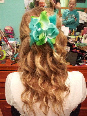 I used a curling wand and some hair spray and the decided to add my flower clip in the back