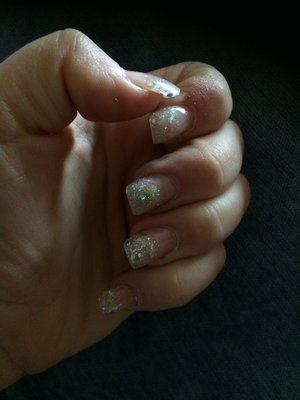 Gel nails with gel sparkled tips that are doubled layered with gel