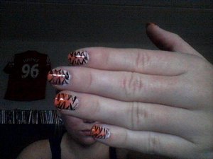 Tiger nails! (Sorry for bad webcam-picture!)

Inspired by Cutepolish 
http://www.youtube.com/user/cutepolish#p/u/4/2tDSXppQZGM