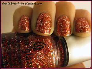 "Love Marilyn" from China Glaze's series of 3D glitters.
Read more about it on my blog here:
http://rainbowifyme.blogspot.com/2011/12/china-glaze-love-marilyn.html