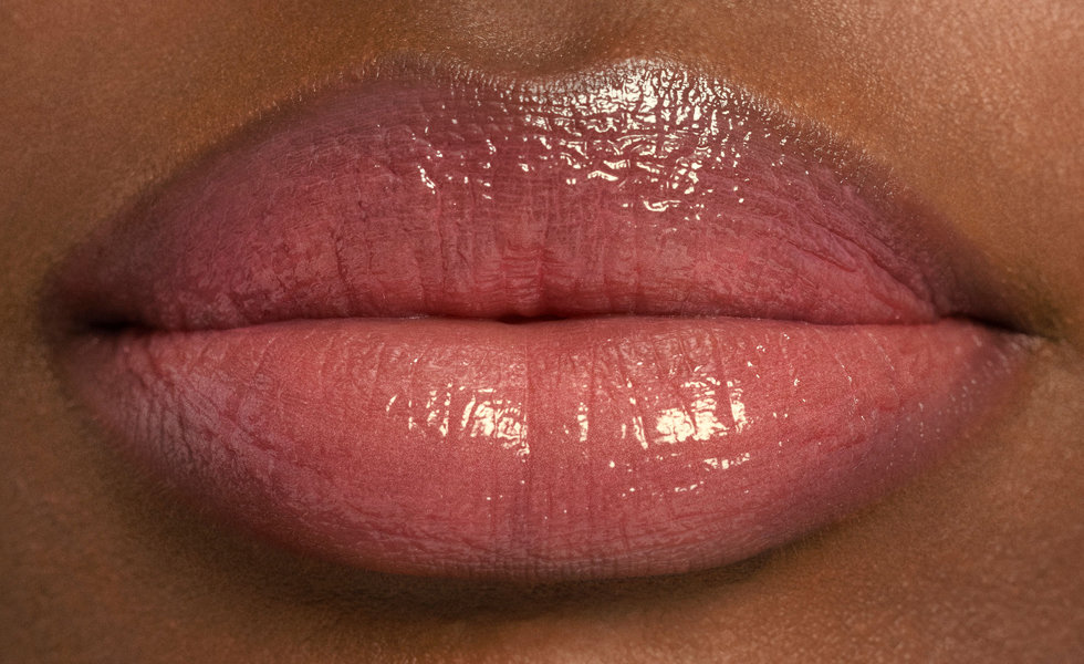 Model wearing Chantecaille Lip Sheer in Monarch