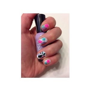 Here is a picture of one of my favorite nail designs that I have created.  This design was based off of cutepolish's dream catcher nails. I have a dream catcher on my ring finger and different color feathers on the rest of my nails.