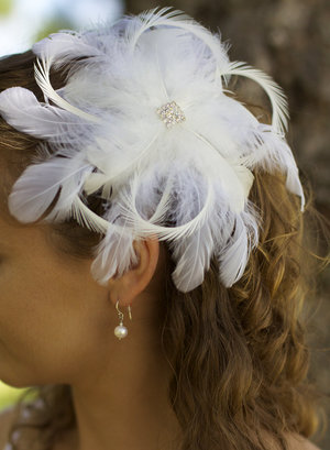 1930s inspired headpiece--hair done half-up in ringlet curls.