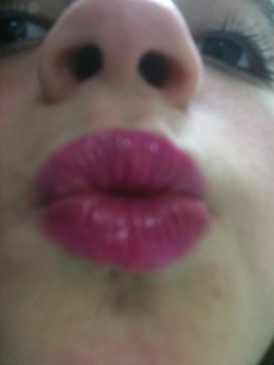 A combo of hot pink and a little red lipstick add shimmer to finish off 