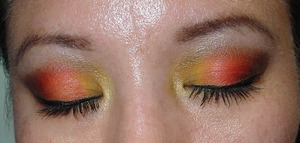 close up 
inner third of eyelid is a mate yellow taxi from Mark new palette superflip . 
middle of eyelid is orange from trio Shangri-la from NYX
outter eyelid is  M.I.A.  a deep chocolate brown from the new Urban Decay 15 year anniversary palette
inner c