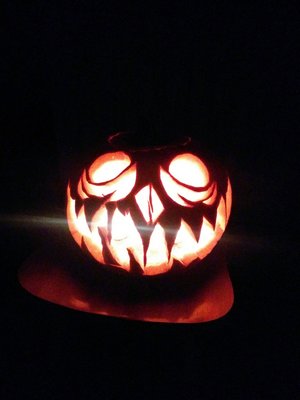 Carved a creepy jack-o-lantern XD got some tasty pumpkin seeds out of it!