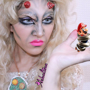 For this look, I kinda hold it dear to my heart. I was asked to be apart of a Demon Princess collab on Instagram with a couple of gorgeous and talented ladies and I thought a cool concept would have been Princess Peach turning into a demon, resulting Mario to fight her off in the final battle.

This tutorial/video I'm proud of and something I took a bit more time on. The decision of doing the Before/After came last minute while editing and I think it really pulled the concept and storyline together. 


PRODUCTS USED
Hard Candy Sheer Dark Spot Corrector Face Primer
Fake Flesh (can't remember where from) 
Liquid Latex by Cinema Secrets
Hard Candy Ten Shadow Palette in Smoked Out
Elizabeth Arden Black Velvet Pencil Liner
Essence White Eyeliner Pencil 
Lancome Noir Liquid Liner
Ice Cream Eraser Tops made into HORNS 
Kat Von D Backstage Bambi Liquid Lipstick
