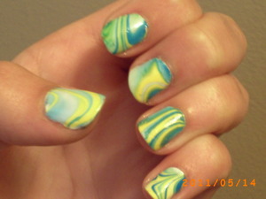 This was my first ever water marble. It's not perfect but considering it was my first try I'd say it's not half bad. I'm a lot better now but this isn't too bad.

For this design I used:

Sally Hansen Xtreme Wear- White On (base)
Sally Hansen Xtreme Wear- Mellow Yellow
Sally Hansen Xtreme Wear- Blizzard Blue
Sally Hansen Xtreme Wear- Blue Me Away