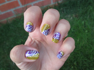 This is a yellow and purple nail polish form Gosh. I split my nails in half and added konad designs (m63) onto it. Blogpost: http://nailartbylynn.tumblr.com/post/25944659314