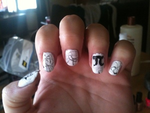 Black and white nail design, white base coat, black paint swirl accents with a Pi symbol 