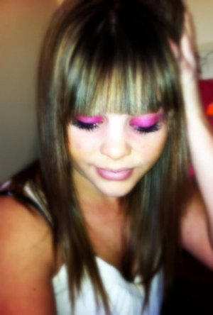 purple eye shadow, long lashes.