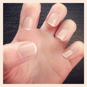 Nude nails with French tips. 