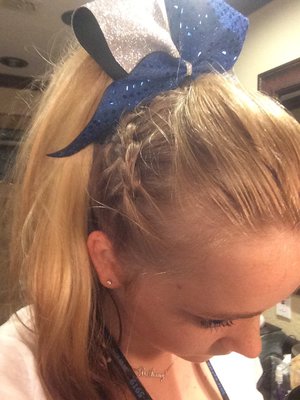 I took the middle part on the top of my head and tied it with an elastic then made 2 Dutch braids on either side of my head and pulled it all up into a high pony. Did this hairstyle for my youth cheerleaders for competition. 