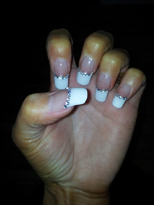 Another view of acrylics with white tips and rhinestones