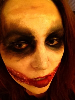 My Joker.  Mehron white cream and liquid latex along with black grease paint and red lipstick were used for this look.