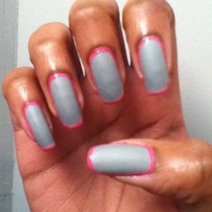 Matte gray nails with shiny pink outlines.