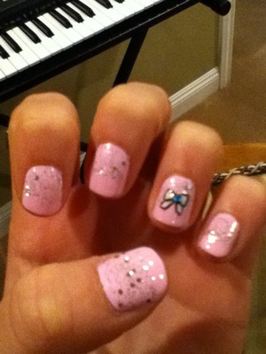 It's pink nails with ombré silver glitter and a bow with a blue crystal! Like yes or no?