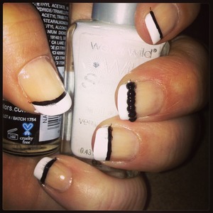 Simple Black and White French Mani Using Wet and wild french white, and La colors Black striper, middle finger has Black gems from Amazon,,