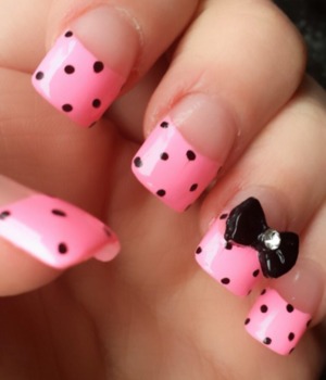 pink background with black polka dots and a black bow :)