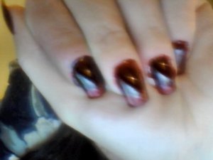 Right hand "blood drops" using a dark red/purple (Avons Tweed) followed with bright red sparkles at the tip (avons: ruby slippers) with a silver "reflection" on the edge and lining the tips to create a "drying" look