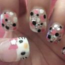 Hello Kitty, dots and glitter nails