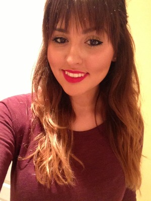 Love a bold red lip with a fringe bang. 