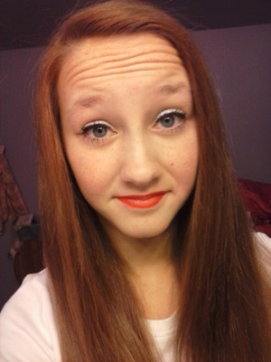 Red lip stick, white eye shadow, and a little bit of cover up. Really simple and nice