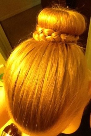 Top view of a sock bun with braid around it!