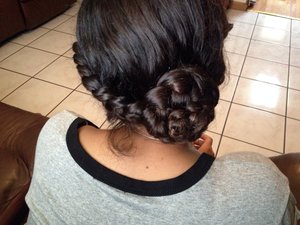 A side French braid turning into a rose 