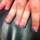 Leopard print tips with pink glitter. 