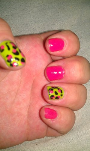 Neon with a little cheetah print on short nails.