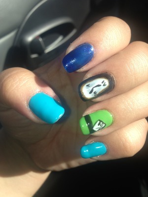 Blue and blue glitter, Disney nails with a melting clock and the mad hatter design 