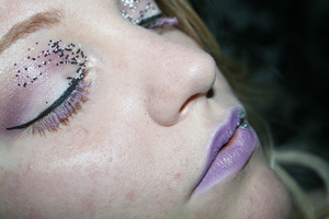 Caviar pearls on the lids and lavender lips