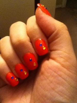 Painted each nail with Cajun Shrimp then glued on rhinestones. Finished with a top coat!