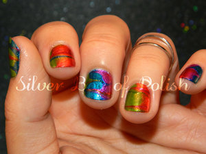 Dry marbled, rainbow colored nails.