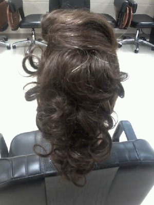 The back of the mannequin i did this cute retro faux hawk on in cosmetology class. :) styled after a roller set.