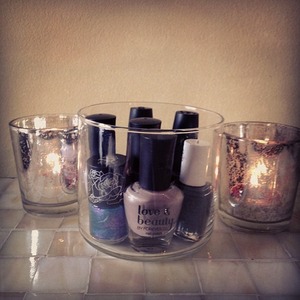 Reuse old candle jars to display nail polishes, etc!