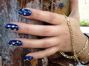 comet nails celestial nails from out of this world and back with beautiful deep blue, wonderful gold sparkles, and cool jems.