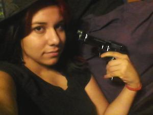 so this is a picture of me with a fake gun, no sleep, and no make up showing my inner glow.