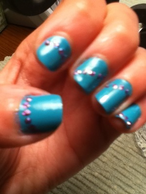 I got these easy polka-dot nails using a pencil to make the dots.:)