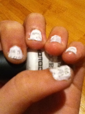 All you need is a white or gray nail polish (I used a white by L.A colors) rubbing alcohol  and newspaper  
