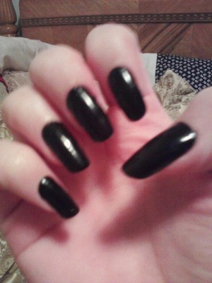 Before I sharpened my nails down, they looked like this. Pretty long and very black. I don't like to use acrylic nails, these are natural.