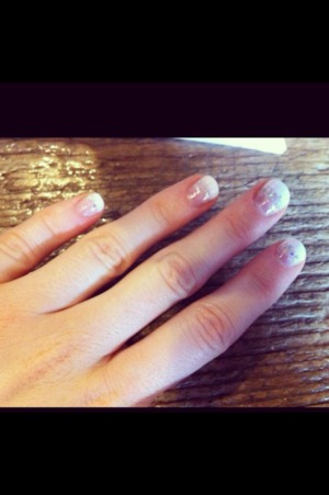 Classic french manicure with shorter than usual tips. A swipe of glitter polish over the top. 
