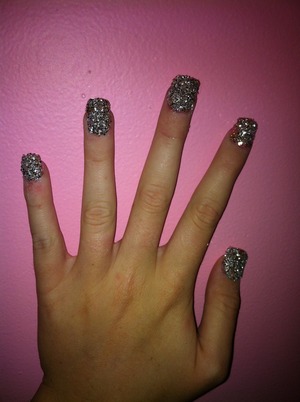 Large, textured glitter put on with clear nail polish