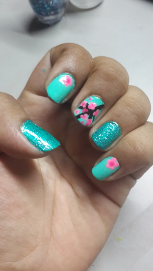 Turquoise nails..Turquoise quitter accent and a pink cherry blossom main nail