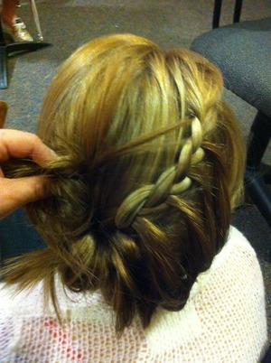 Lace braid starting from right side, moving left and twisting into a little bun.(: