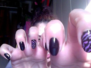 Stiletto nails are cool but oval nails are hotter! A lil more feminine than roar roar, if you want an alternative. Black base and lilac tiger stripes :) 