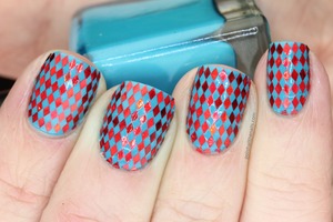 Using Urban Outfitters Babyboy polish and red holographic diamond glitter, I present Harlequin nails!

Full details in my blog post here: http://www.polishallthenails.com/2013/01/blue-and-red-harlequin-nails.html?site=beautylish